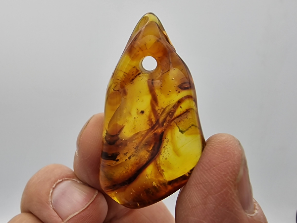 amber with drilling